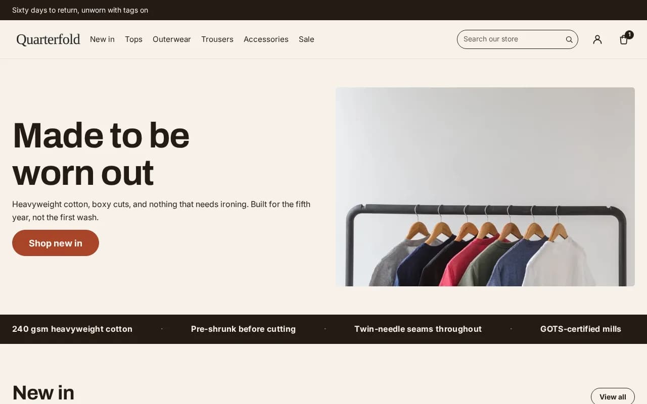 Apparel homepage: a headline, a line of body copy and one call to action set beside a photograph of a clothes rail